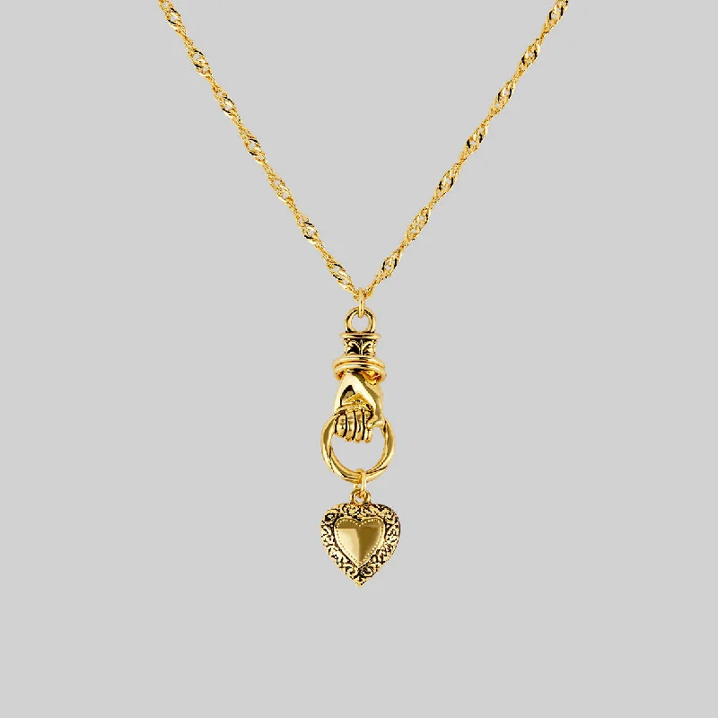 Dome charm necklace-ALL OF ME. Hand Grasping Heart Necklace - Gold