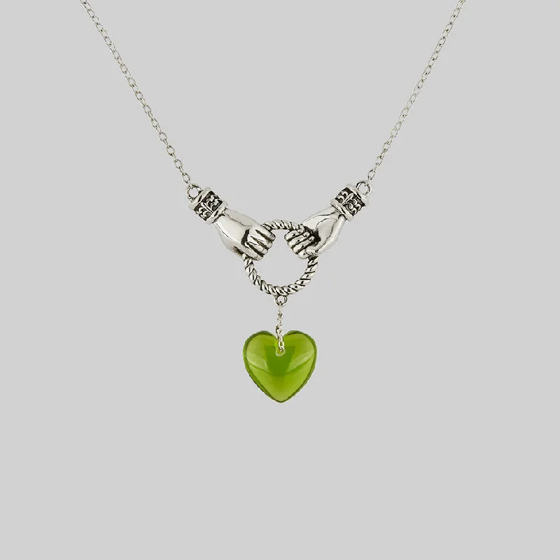 Tall bezel necklace-UNITE. Hand Grasping Green Glass Heart Necklace - Silver