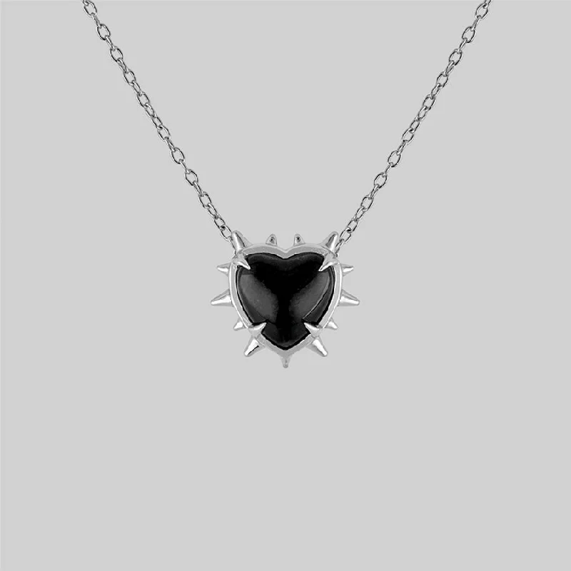 Tusk ridge necklace-VOID. Spiked Black Glass Heart Necklace - Silver